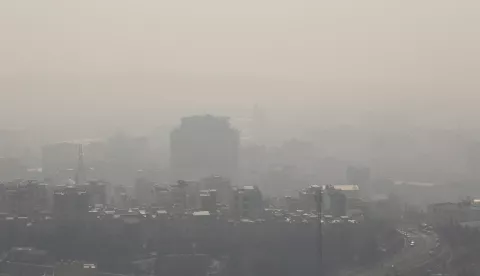 epa10386218 Smog obscures the skyline in Tehran, Iran, 02 January 2023. According to the Iranian meteorology organization the country's capital Tehran is in a red warning zone, prompting the Iranian government to announce a closure of schools and universities for two days while implementing stricter rules for traffic zones and insisting that elderly and sick people stay indoors. EPA/ABEDIN TAHERKENAREH