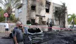 epa11618485 Israeli emergency teams inspect the damage at the scene of a missile strike on a residential neighbourhood in Kiryat Bialik, northern Israel, 22 September 2024. The Israeli military said that about 85 projectiles were identified crossing from Lebanon into several areas in northern Israel on 22 September. Some of the shells were intercepted, and fallen projectiles were located in Kiryat Bialik, Tsur Shalom and Moreshet, igniting fires in the area, the statement added. Following the attack on northern Israel the Israel Defense Forces (IDF) said it conducted strikes against Hezbollah targets in Lebanon. EPA/ABIR SULTAN