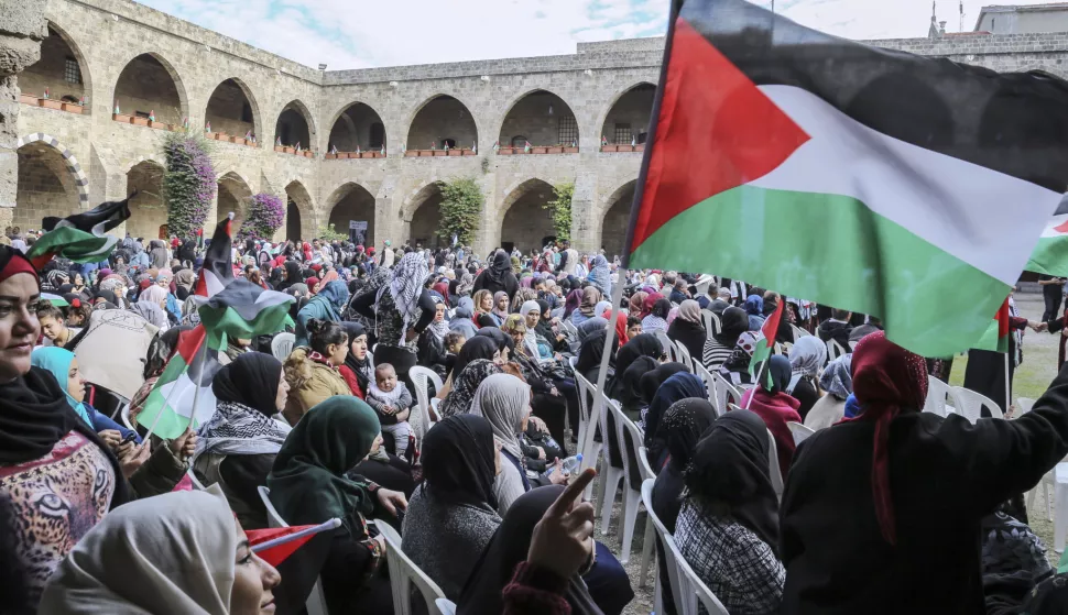 epa07193047 Palestinians women wave a flag as she attends an open day with the first generation of Palestinian refugees in Lebanon on the occasion of the International Day of Solidarity with the Palestinian People in Sidon, Lebanon, 27 November 2018. The first generation of Palestinian refugees since the Nakba gathered in Sidon two days ahead of the International Day of Solidarity with the Palestinian People, which is held on 29 November to mark the anniversary of Resolution 181. EPA/Nabil Mounzer