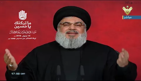 epa07033286 A tv grab handout photo from Hezbollah's al-Manar TV shows Hezbollah leader Sayed Hassan Nasrallah giving a televised address during the tenth night of the month of Muharram (Ashura) in Southern suburb of Beirut, Lebanon, 19 September 2018. Nasrallah spoke about the situations in Lebanon and the Arabic countries like Syria and Yemen. Shiite Muslims across the world are observing Muharram, the first month of the Islamic calendar. The climax of Muharram is the Ashura festival commemorating the martyrdom of Imam Hussein, a grandson of the Prophet Mohammed in the Iraqi city of Karbala in the seventh century. EPA/AL-MANAR TV GRAB/HANDOUT HANDOUT EDITORIAL USE ONLY/NO SALES