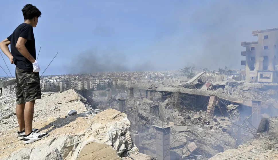 epa11630054 A man looks at a damaged building at the site of an Israeli airstrike in Choueifat, southeast of Beirut, Lebanon, 28 September 2024. The Israeli army (Tsahal) said on 28 September 2024 on X (formerly Twitter) that Hezbollah leader Hassan Nasrallah was killed in an overnight strike on Beirut. Hezbollah confirmed the death of Nasrallah in a statement on 28 September 2024. EPA/WAEL HAMZEH