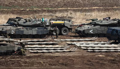 epa11633431 Israeli military vehicles at a gathering site next to the border with Lebanon as seen from an undisclosed location in northern Israel, 30 September 2024. The Israeli military announced on 30 September that it had eliminated the head of the Lebanon Branch of Hamas during an 'overnight joining IDF and ISA intelligence-based' operation in Lebanon.