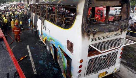 epa11634698 Rescue workers and firefighters inspect a bus that burned after a gas leak at Vibhavadi Rangsit road in Bangkok, Thailand, 01 October 2023. At least 10 students were killed in the accident and many others were injured, police said. EPA/NARONG SANGNAK