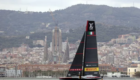 epa11611839 Luna Rossa Prada Pirelli of Italy and NYYC American Magic of US (unseen) compete on the fourth day of the Louis Vuitton Cup Semi-Finals within the America's Cup sailing competition, in Barcelona, Spain, 18 September 2024. EPA/TONI ALBIR