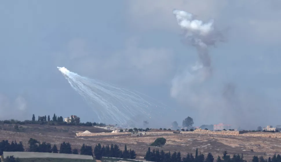 epa11637424 Flares and smoke during an Israeli airstrike near Yaroun village in southern Lebanon, as seen from an undisclosed location on the Israeli side of the border, northern Israel, 02 October 2024. The Israeli military reported that additional forces were joining the raids on Hezbollah targets and infrastructure in southern Lebanon that began on 30 September. EPA/ATEF SAFADI