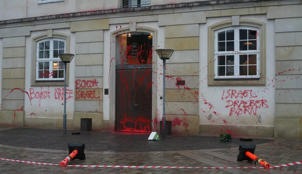 epa11625490 A view of the facade of the Ministry of Foreign Affairs Eigtveds Pakhus smeared with red paint, in Copenhagen, Denmark, 26 September 2024. The vandalism included anti-Israel messages. Police are investigating the incident. EPA/EMIL HELMS DENMARK OUT