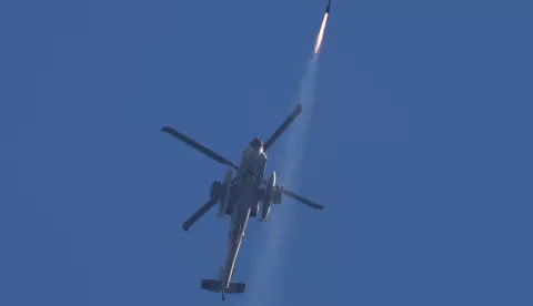 epa11642035 An Israeli Apache helicopter fires a missile toward targets in southern Lebanon, as seen from the Upper Galilee, northern Israel, 04 October 2024. The Israeli army reported that multiple projectiles were identified crossing from Lebanon to the the Upper Galilee area, with some of the projectiles successfully intercepted while others fell in open areas. EPA/ATEF SAFADI