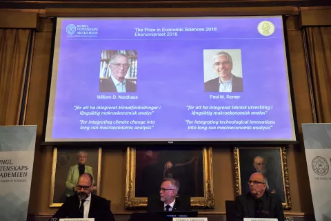 epa07078535 From L-R Per StrAśmberg, professor, GAśran K. Hansson and Per Krusell announce the laureates of the Nobel Prize in Economics during a press conference at the The Royal Swedish Academy of Sciences in Stockholm, 08 Ocktober 2018. The Nobel committee announced the Nobel Prize in Economic Sciences has been awarded jointly to William D. Nordhaus (L on screen) of Yale University, New Haven, USA and Paul M. Romer (R on screen) of NYU Stern School of Business, New York, USA. EPA/HENRIK MONTGOMERY SWEDEN OUT