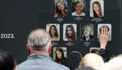 epa11315692 People pay tribute to the victims of the shooting at 'Vladislav Ribnikar' elementary school in Belgrade, Serbia, 03 May 2024. On 03 May 2023, a teenage student fatally shot nine students and a school guard using two handguns, which he had taken from his father. Six others, five students and a teacher, also sustained injuries in the attack. EPA/ANDREJ CUKIC