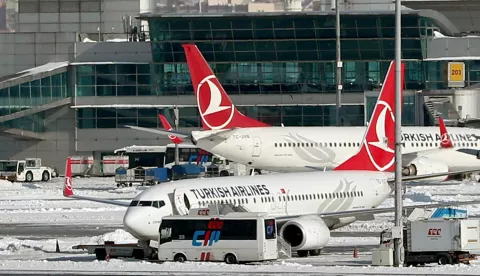 epa05720383 (FILE) - A file picture dated 08 January 2017 shows Turkish Airlines planes and aircraft of other international airlines being grounded at the Ataturk international airport in Istanbul, Turkey. According to media reports on 16 January 2017, Turkish Airlines Flight 6491 crashed into a residential area near the Kyrgyzstan capital of Bishkek, killing the pilot and at least 20 people on the ground, while en route from Hong Kong to Manas International Airport. The plane was carrying cargo to Istambul. There is currently no information on the number of crew on board at the time of the crash. EPA/SEDAT SUNA