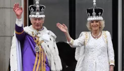 epaselect epa10612353 Britain's King Charles III (L) and Queen Camilla wave from the balcony of Buckingham Palace following their Coronation in London, Britain, 06 May 2023. The appearance on the balcony is to greet the crowds who have gathered in The Mall and to watch a fly past. EPA/Neil Hall