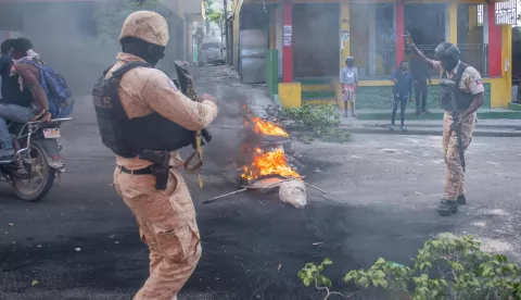 epa11134366 Police try to control a large anti-government protest, in Port-au-Prince, Haiti, 7 February 2024. Haiti is facing a climate of uncertainty as the mandate of Prime Minister Ariel Henry is set to end on 07 February, as per the agreement signed in December 2022 with representatives of political parties, social organizations, and members of the private sector. In recent days, there have been intensified anti-government demonstrations and calls for Henry's resignation. This is happening in a context marked by the closure of schools and the resumption of armed conflicts between gangs, which is causing thousands of people to flee their homes. EPA/JOHNSON SABIN