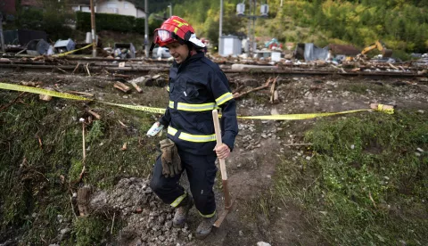 epa11643861 A rescue worker moves through the debris brought by the flash floods in the village of Donja Jablanica, Bosnia and Herzegovina, 05 October 2024. Central and southern parts of Bosnia and Herzegovina were hit by a severe rainstorm on 03 October 2024, which caused widespread flooding, closing roads, cutting electricity, and disrupting telecom signals. Rescue services in Jablanica and Kiseljak reported several people missing and called for army assistance, as access to Jablanica was completely blocked due to road and rail closures. 19 fatalities due to the flash floods have been confirmed so far by the regional government of Hercegovacko-Neretvanska county. EPA/NIDAL SALJIC