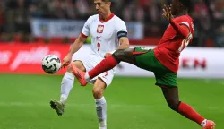 epa11656482 Robert Lewandowski (L) of Poland in action against Nuno Mendes (R) of Portugal during the UEFA Nations League group A1 soccer match between Portugal and Poland, in Warsaw, Poland, 12 October 2024 EPA/Piotr Nowak POLAND OUT