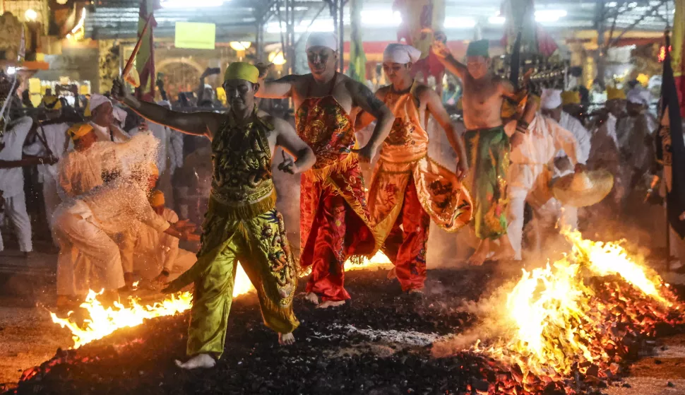 epa11654960 Malaysian ethnic Chinese walk on burning charcoal during the last day of the Nine Emperor Gods festival in Kuala Lumpur, Malaysia, 11 October 2024. The Nine Emperor God Festival, also known as the Vegetarian Festival, is an annual Taoist celebration held during the ninth lunar month of the Chinese calendar. During the nine-day period, worshipers will abstain from consuming meat, only consume vegetarian food, and make merit, all aimed at cleansing their body and mind. The festival is mainly celebrated in Southeast Asian countries. EPA/FAZRY ISMAIL