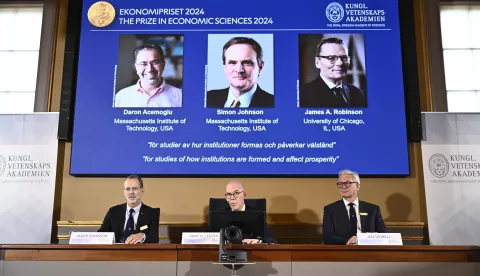 epa11658095 Academy of Sciences permanent secretary Hans Ellegren (C), Jakob Svensson (L) and Jan Teorell, of the Nobel assembly at the Swedish Riksbank announces the Swedish Riksbank's prize in economic science in memory of Alfred Nobel 2024, which goes to Daron Acemoglu, Simon Johnson and James A Robinson, during a press meeting at the Royal Swedish Academy of Sciences in Stockholm, Sweden, 14 October 2024. EPA/Christine Olsson/TT SWEDEN OUT