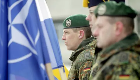 epa05776009 Soldiers partake in a welcoming ceremony for the first troops of the NATO enhanced Forward Presence (eFP) battalion group at the Rukla base in Rukla, Lithuania, 07 February 2017. NATO decided to station a multinational battalion in each of the three Baltic countries in response to Russia's intervention in Ukraine and military activity in the region. EPA/VALDA KALNINA