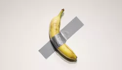 Maurizio Cattelan's "Comedian" is on display at a press preview for Sotheby's Evening Auction on October 25, 2024 in New York City. The conceptual piece, a banana duct-taped to a wall, went viral in 2019 and one of its three editions is estimated to sell for between  to .5 million dollars. Photo by John Angelillo/UPI Photo via Newscom Photo: John Angelillo/NEWSCOM