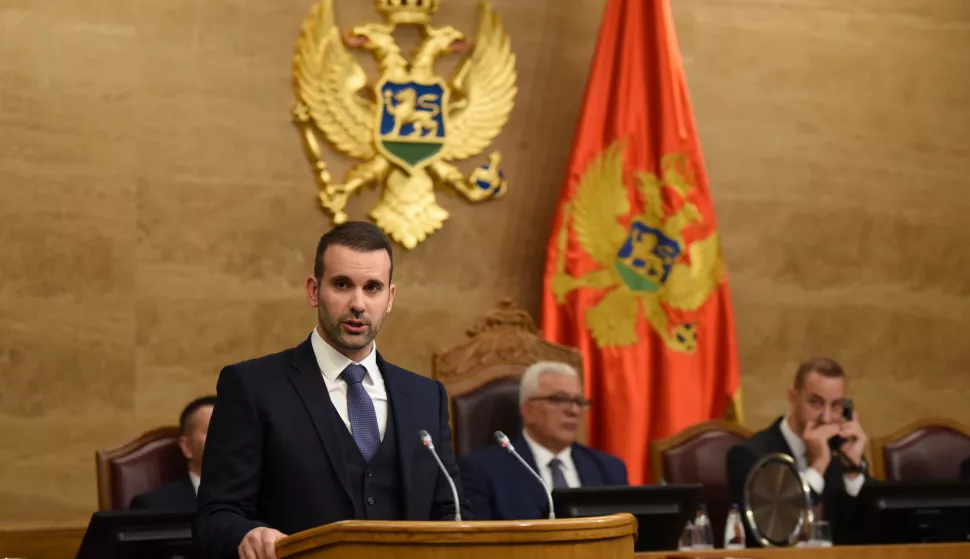 epa10949726 Montenegro's Prime Minister designate Milojko Spajic addresses the Parliament in Podgorica, Montenegro, 30 October 2023. Spajic announced his candidates for ministerial positions. Europe Now party President and Prime Minister designate Milojko Spajic managed to form a coalition government after the snap parliamentary elections on 11 June 2023. EPA/BORIS PEJOVIC