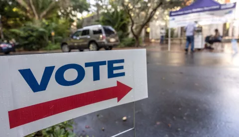 epa11673313 A sign points to a secure ballot intake station on Florida's first early voting day for the 2024 US presidential election at the Coral Gables regional library in Miami, Florida, USA, 21 October 2024. Voters in Florida can cast their ballots in person for the presidential election, starting on 21 October, avoiding long lines on Election Day on 05 November 2024. EPA/CRISTOBAL HERRERA-ULASHKEVICH