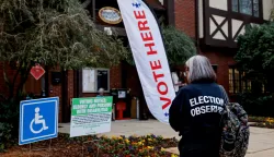 epa11702601 An election observer with the American Civil Liberties Union (ACLU) monitors activity as voters arrive to cast their ballots at the Dekalb County Avondale Estates City Hall voting precinct as the polls open on Election Day in Avondale Estates, Georgia, USA, 05 November 2024. Voters across the country are casting ballots today for President of the United States in a tightly contested race between Republican presidential candidate Donald J. Trump and Democratic presidential candidate US Vice President Kamala Harris, as well as for candidates in Senate and Congressional races. EPA/ERIK S. LESSER