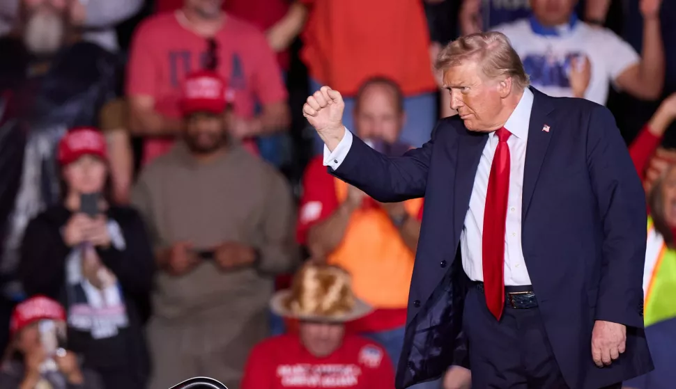 epa11695168 Former US President and Republican Presidential candidate Donald J. Trump waves his fist during a campaign event at Lee's Family Forum in Henderson, Nevada, USA, 31 October 2024. EPA/ALLISON DINNER