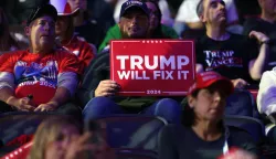 epaselect epa11701301 Supporters wait for former US President Donald Trump to attend a rally in Reading, Pennsylvania, USA, 04 November 2024. Trump and US Vice President and Democratic presidential candidate Kamala Harris are tied in the polls ahead of the US presidential election on 05 November. EPA/WILL OLIVER