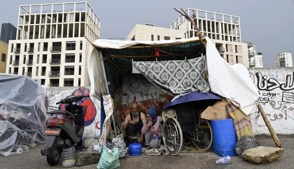 epa11697708 Internally displaced Lebanese resting in a tent during a rainy day at Martyrs Square in Beirut, Lebanon, 02 November 2024. The International Organization for Migration (IOM) has recorded over 830,000 internally displaced people (IDPs) in Lebanon since the start of recent escalations of hostilities. EPA/WAEL HAMZEH