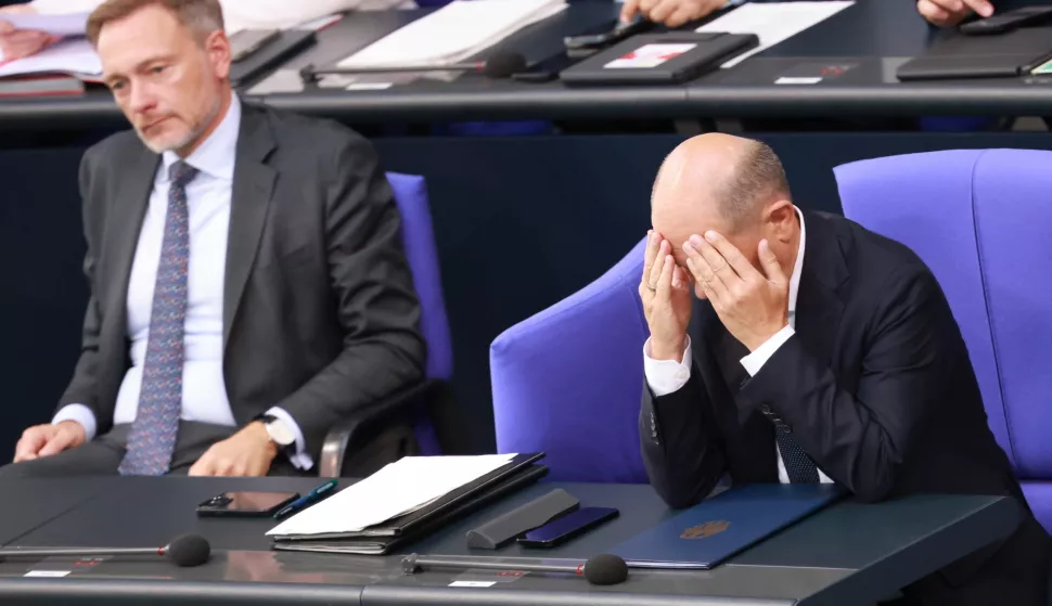 epa11705997 (FILE) - German Chancellor Olaf Scholz (R) reacts after delivering a government declaration, as he sits next to German Finance Minister Christian Lindner (L), in the German parliament 'Bundestag', in Berlin, Germany, 26 June 2024 (reissued 06 November 2024). German Chancellor Scholz announced on 06 November 2024, the dismissal of German Finance Minister Christian Lindner in the course of ongoing consultations between parts of the so-called traffic light coalition of SPD, Greens and FDP. EPA/CLEMENS BILAN