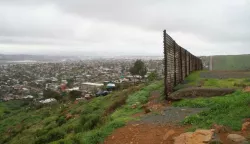 epa05777392 A view of the end of the fence that separates the Mexican (L) and the US territory in Baja California, Mexico, 07 February 2017. Porfirio Hernandez's home, in the Nido de Aguilas (Eagles' Nest) section of Tijuana, is located near a gap in the US-Mexico wall, and it receives frequent visit of immigrants who are in need of water and of help. EPA/ALEJANDRO ZEPEDA