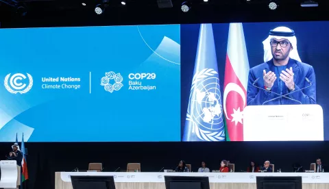 epa11714141 UAE's Minister of Industry and Advanced Technology and COP28 President, Sultan Al Jaber (L), appears on a screen (R) as he delivers his speech at the opening ceremony of the UN Climate Change Conference (COP29) in Baku, Azerbaijan, 11 November 2024. The Azerbaijani capital of Baku hosts the 2024 United Nations Climate Change Conference (COP29) from 11 to 22 November 2024. EPA/IGOR KOVALENKO