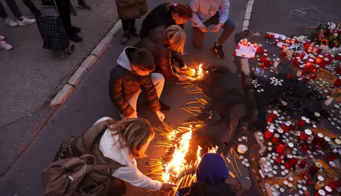 epa11697650 People light candles during the vigil for the victims of the collapse of the canopy at the railway station in Novi Sad, Serbia, 02 November 2024. Fourteen people lost their lives in the collapse of the Novi Sad Railway Station canopy that occurred on 01 November, as stated by Interior Minister Ivica Dacic. The mayor of Novi Sad, Milan Djuric, reported over 30 injuries in the incident, which occurred just before noon. The recently renovated station building, reopened on 05 July 2024, was undergoing another renovation shortly before the collapse. EPA/ANDREJ CUKIC