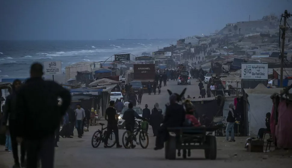 epa11715324 Displaced Palestinians walk near their tents, set up along the beach in the west of Al Nuseirat refugee camp, central Gaza Strip, 11 November 2024. According to the UN, at least 1.9 million people (or nine in ten people) across the Gaza Strip are internally displaced, including people who have been repeatedly displaced. Since October 2023, only about 11 percent of the Gaza Strip has not been placed under Israeli-issued evacuation orders, the UN aid coordination office OCHA said. More than 43,600 Palestinians and over 1,400 Israelis have been killed, according to the Palestinian Health Ministry and the Israeli Army, since Hamas militants launched an attack against Israel from the Gaza Strip on 07 October 2023, and the Israeli operations in Gaza and the West Bank which followed it. EPA/MOHAMMED SABER