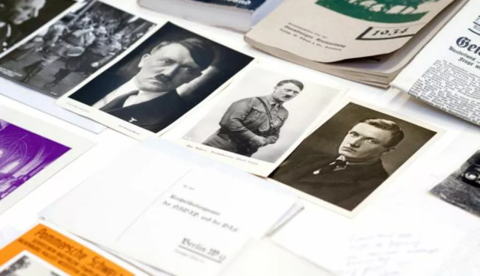 epa05539436 Photographs and documents showing Nazi leader Adolf Hitler from a time capsule are presented at the National Museum in Szczecin, Poland, 14 September 2016. The time capsule with historic coins, archival German newspapers, pictures, promotion movie of Falkenburg - the old name of Zlocieniec town, and an appeal to the future residents was found couple days ago in Zlocieniec town, north-west Poland. It was buried 80 years ago under the construction of the Ordensburg Krossinsee center that educated future Nazi employees and officers. Documents and other memorabilia will be translated and preserved and then made available to the citizens of Zlocieniec. EPA/TOMASZ MURANSKI POLAND OUT