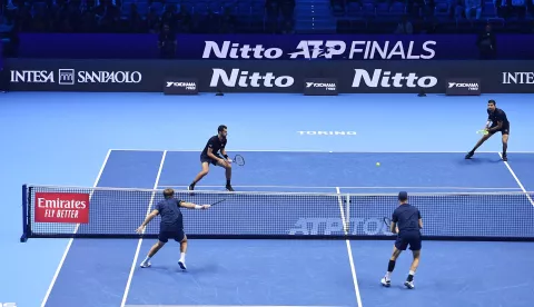 epa11725974 Marcelo Arevalo of El Salvador and Mate Pavic of Croatia (up) in action against Kevin Krawietz and Tim Puetz of Germany during the Double final match at the ATP Finals in Turin, Italy, 17 November 2024. EPA/Alessandro Di Marco