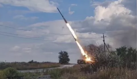 epa11545482 A handout still image taken from handout video provided by the Russian Defence ministry press-service shows the crew of the 'Uragan' multiple launch rocket system of the artillery of the Vostok group of forces launching in one of the sections of the line of combat contact of the South Donetsk direction of the special military operation, Donetsk region, 11 August 2024. EPA/RUSSIAN DEFENCE MINISTRY PRESS SERVICE/HANDOUT HANDOUT EDITORIAL USE ONLY/NO SALES