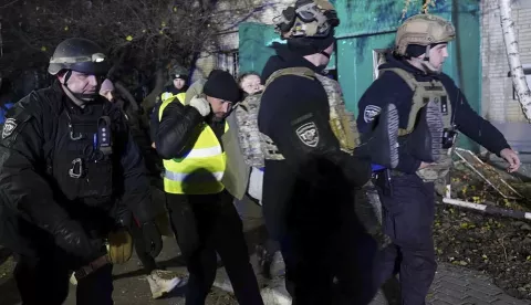 epa11726610 A handout photo released by the press service of the State Emergency Service of Ukraine shows Ukrainian rescuers escort an injured person at the site of a rocket hit on a residential building in Sumy, Ukraine, 17 November 2024. At least 10 people were killed, including two children, and 51 others were injured during the evening rocket attack a nine-storey residential building according the State Emergency Service (SES) of Ukraine. Russian troops entered Ukrainian territory on 24 February 2022, starting a conflict that has provoked destruction and a humanitarian crisis. EPA/STATE EMERGENCY SERVICE HANDOUT 69086HANDOUT EDITORIAL USE ONLY/NO SALES