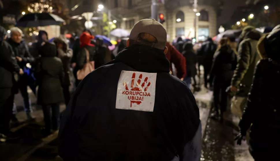 epa11715232 A protester wears a sticker reading 'Corruption kills' during a rally of support for the victims of the Novi Sad railway station accident, in Belgrade, Serbia, 11 November 2024. Opposition parties rallied in support of the victims of a recent accident in Novi Sad. Fourteen people lost their lives in the collapse of the Novi Sad Railway Station canopy on 01 November 2024. The station building, which had been renovated and reopened on 05 July 2024, was undergoing further renovations shortly before the collapse. EPA/ANDREJ CUKIC