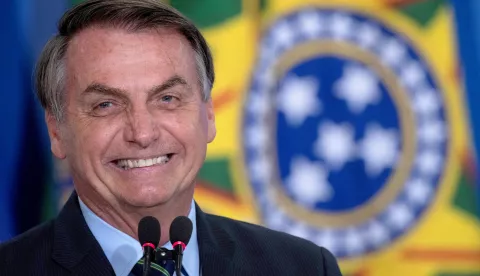 epa08532717 (FILE) - The President of Brazil Jair Bolsonaro reacts during Actress Regina Duarte, known for her roles in famous soap operas, ceremony to assume the Ministry of Culture, in Brasilia, Brazil, 04 march 2020 (reissued 07 July 2020). Bolsonaro, 65, reported on 07 July that he has tested positive for COVID-19 and has begun to be treated with chloroquine. EPA/Joedson Alves *** Local Caption *** 55927587