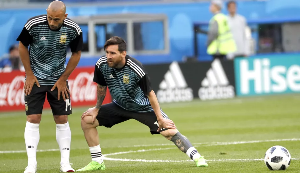 epa06842378 Lionel Messi (R) and Javier Mascherano of Argentina warm prior the FIFA World Cup 2018 group D preliminary round soccer match between Nigeria and Argentina in St.Petersburg, Russia, 26 June 2018.(RESTRICTIONS APPLY: Editorial Use Only, not used in association with any commercial entity - Images must not be used in any form of alert service or push service of any kind including via mobile alert services, downloads to mobile devices or MMS messaging - Images must appear as still images and must not emulate match action video footage - No alteration is made to, and no text or image is superimposed over, any published image which: (a) intentionally obscures or removes a sponsor identification image; or (b) adds or overlays the commercial identification of any third party which is not officially associated with the FIFA World Cup) EPA/ETIENNE LAURENT  EDITORIAL USE ONLY