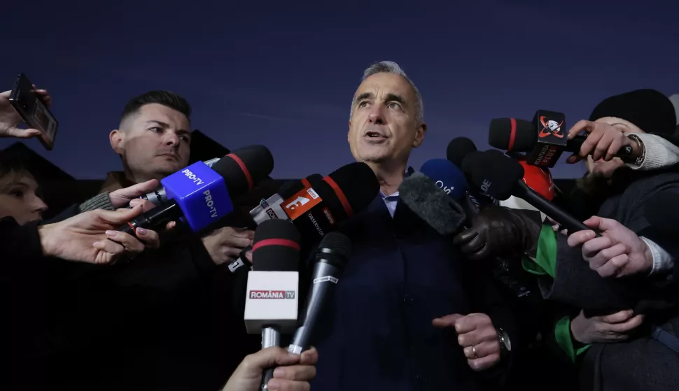 epa11741846 Far-right independent runoff candidate Calin Georgescu delivers a speech during a media statement following his surprise win in the first round of presidential elections, in front of his residence in Izvorani village, 40 Km north from Bucharest, Romania, 26 November 2024. Calin Georgescu led in the first round of the presidential race, winning 22.94 percent of the total number of votes, followed by Elena Lasconi, leader of the USR (Save Romania Union), with 19.18 percent. The second round of Romania's presidential election will be held on 08 December 2024. EPA/ROBERT GHEMENT