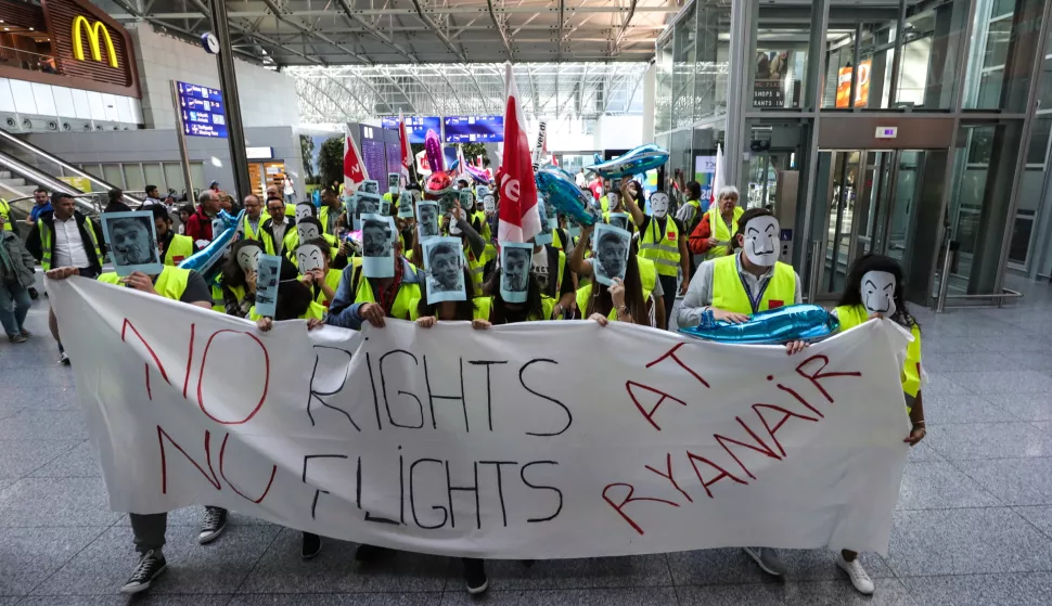 epa07053778 Employees of Ryanair airline hold a banner reading 'No Rights No Flights at Ryanair' as they wear masks with the picture of Ryanair CEO O'Leary during a protest at the airport in Frankfurt Main, Germnay, 28 September 2018. Ireland-based low-cost airline Ryanair has cancelled 250 flights scheduled for 28 September due to a pilot and cabin crew strike. Ryanair cabin crews in Belgium, Germany, Italy, the Netherlands, Portugal and Spain have also gone on strike in a row over contracts and conditions, with unions demanding that staff be hired under contracts in the countries where they are based instead of under Irish law. EPA/ARMANDO BABANI