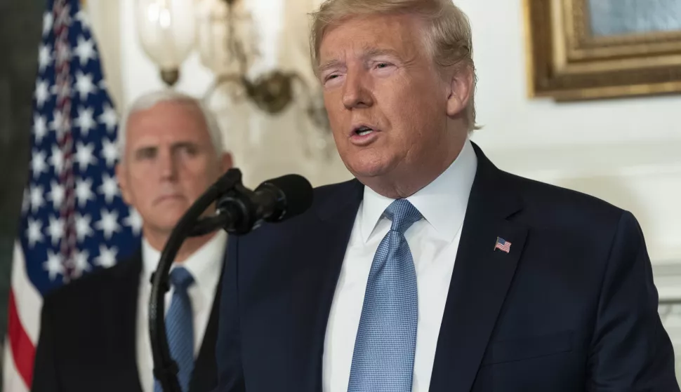 epa07757952 US President Donald J. Trump makes a statement at the White House in Washington, DC, USA, on 05 August 2019 in response to two separate shooting incidents. US Vice President Mike Pence looks on from left. EPA/Chris Kleponis/POOL