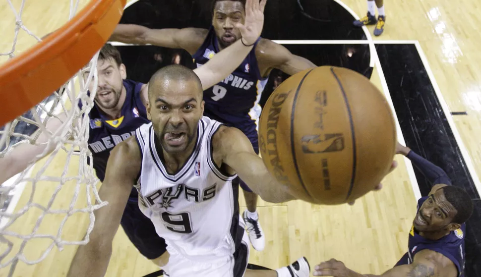 San Antonio Spurs' Tony Parker (9), of France, drives to the basket as Memphis Grizzlies' Marc Gasol, left, of Spain, Tony Allen (9) and Mike Conley, right, defend during the first quarter of Game 2 of a first-round NBA basketball playoff series, Wednesday, April 20, 2011, in San Antonio. (AP Photo/Eric Gay)