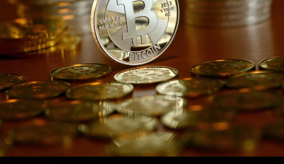 Illustration - A Bitcoin coins pictured at the coin dealer BitcoinCommodities in Berlin, Germany, 28 November 2013. When paying with bitcoin, no actual monetary exchange takes place between buyer and seller. Instead, the buyer requests an update to a public transaction log, the blockchain. Photo: Jens Kalaene | usage worldwide/DPA/PIXSELL