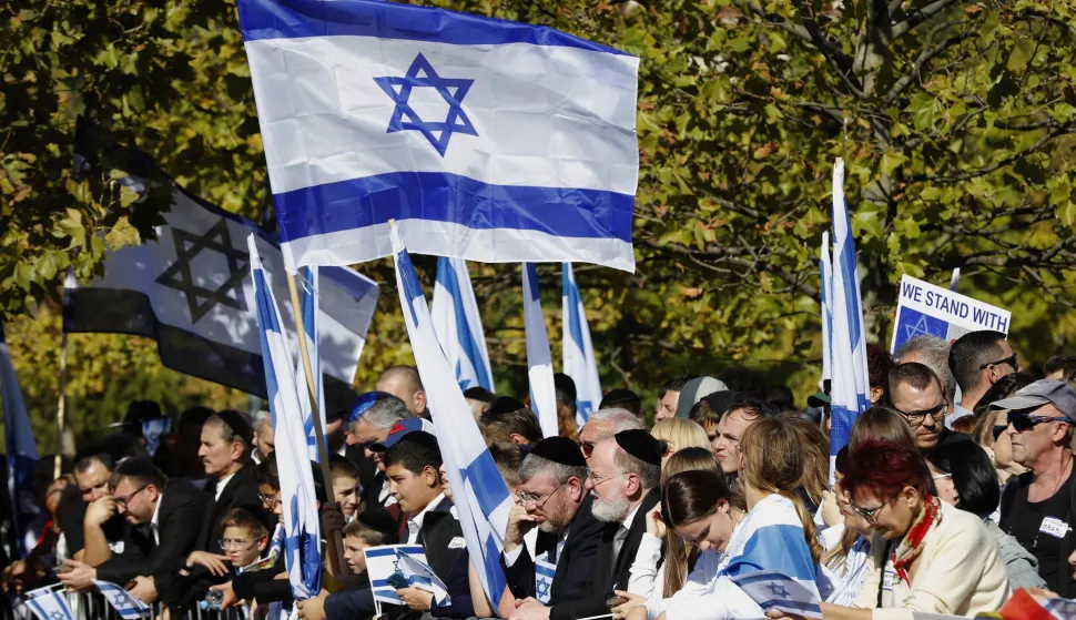 epa10914947 People with Israeli flags demonstrate in support of Israel in front of Parliament building, in Bucharest, Romania, 12 October 2023. Hundreds of people attended the demonstration organized by the Jewish Community of Bucharest, Israeli embassy in Bucharest and Laude-Reut High School of Bucharest after the Israeli-Palestinian conflict escalated. Thousands of Israelis and Palestinians have died since the militant group Hamas launched an unprecedented attack on Israel from the Gaza Strip on 07 October 2023, leading to Israeli retaliation strikes on the Palestinian enclave. EPA/ROBERT GHEMENT