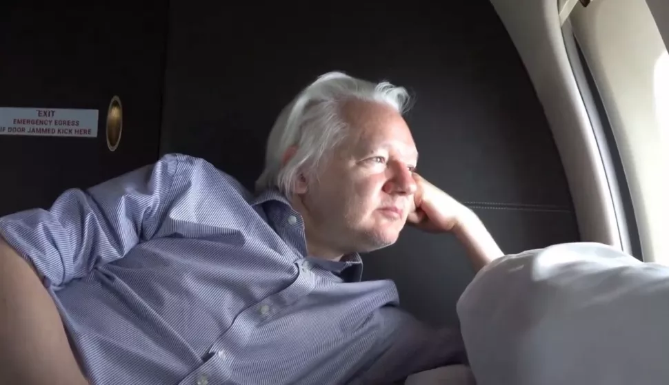 epa11437634 A still image taken from a handout video made available by WikiLeaks shows WikiLeaks founder Julian Assange looking out of the window of a plane at an undisclosed location, 25 June 2024. Julian Assange's flight VJT199 took off from Bangkok on 25 June, heading towards US airspace and Saipan Island, following a layover in the Thai capital. According to court filings in the US district court for the Northern Mariana Islands, US prosecutors said they anticipate Assange will plead guilty to the criminal count of conspiring to obtain and disclose classified documents relating to the national defense of the United States. WikiLeaks posted a statement on social media saying that Assange was freed from Britain's Belmarsh maximum security prison on 24 June morning, after having spent 1,901 days there. He was granted bail by the High Court in London and was released at Stansted Airport during the afternoon. Following his release on bail, he departed the UK for Australia. His wife Stella confirmed on X that 'Julian is free' and thanked supporters. EPA/WIKILEAKS HANDOUT -- MANDATORY CREDIT -- BEST QUALITY AVAILABLE -- HANDOUT EDITORIAL USE ONLY/NO SALES HANDOUT EDITORIAL USE ONLY/NO SALES