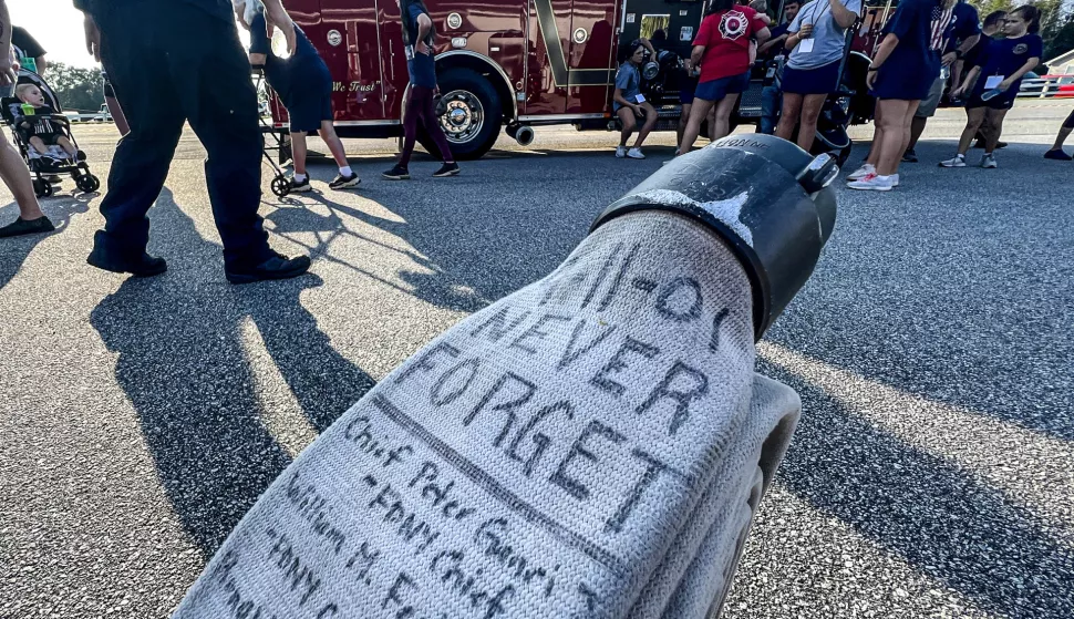 Sept 10, 2023; Belton, SC, USA; A firehose with the words "9-11-01, Never Forget" and names of fallen from the events of Sept 11. Firemen, family and supporters walk in the 9/11 Walk to Remember, starting from Rock Springs fire station 2.5 miles to Belton, with ceremonial bell ringing at the Belton fire station Sunday, September 10, 2023. The event welcomes all first responders, families and citizens to come and show support for the lives lost on September 11, 2001. Mandatory Credit: Ken Ruinard-USA TODAY NETWORK/Sipa USA Photo: USA TODAY NETWORK/SIPA USA