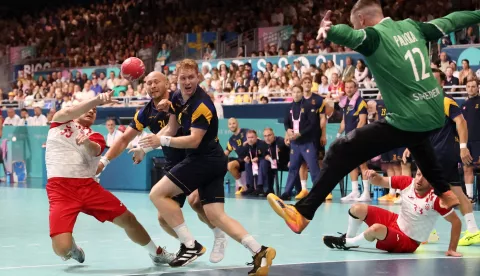 epa11518945 Marin Sipic (L) of Croatia in action against goalkeeper Andreas Palicka (R) of Sweden during the Men's Preliminary Round Group A match between Croatia and Sweden at the Handball competitions in the Paris 2024 Olympic Games, at the South Paris Arena in Paris, France, 02 August 2024. EPA/YAHYA ARHAB