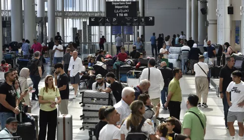 epa11526966 Passengers wait after their flights were delayed or canceled at Rafic Hariri International Airport, in Beirut, Lebanon, 05 August 2024. Several countries including the US, Britain, France, Saudi Arabia, Germany, Kuwait and Italy have urged their citizens to leave Lebanon due to heightened tensions in the region. EPA/WAEL HAMZEH